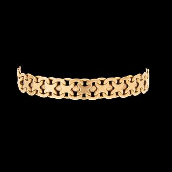 An 18K gold bracelet.