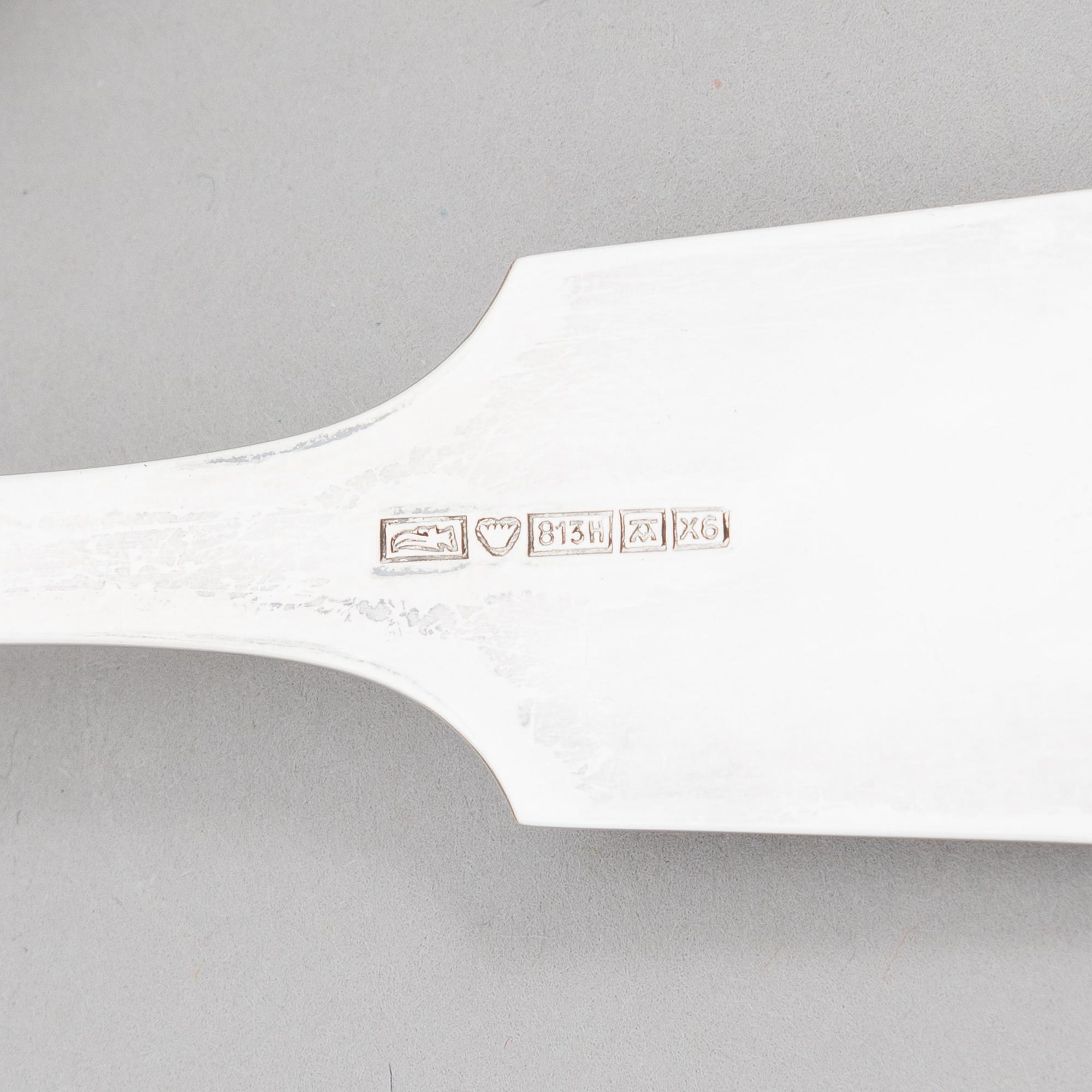 A 42-piece set of silver cutlery with seashell decorated handles, Finnish hallmarks, 1918-1950.