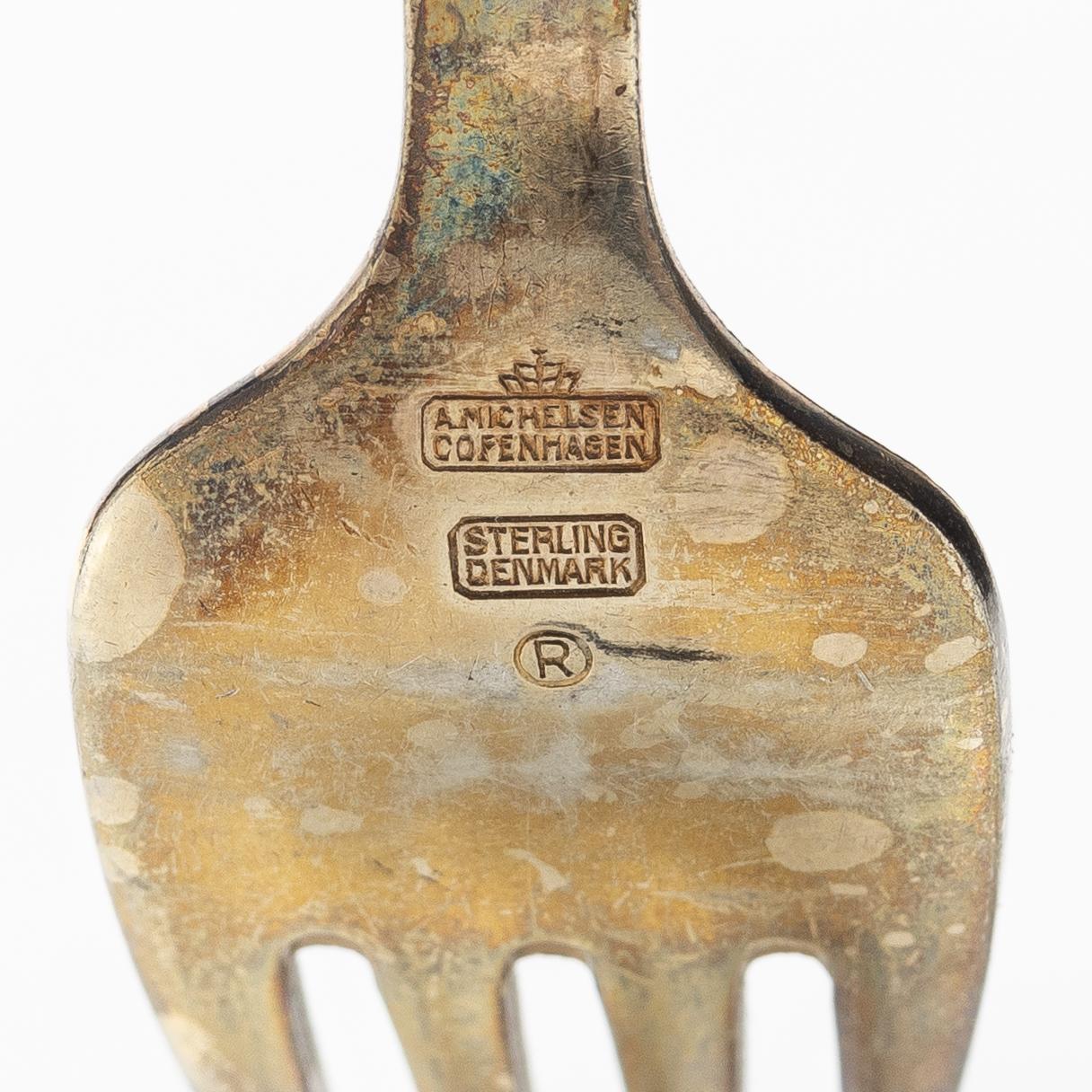 A set of sterling silver and enamel christmas cutlery, Michelsen, Denmark 1940s-1960s (34 pieces).