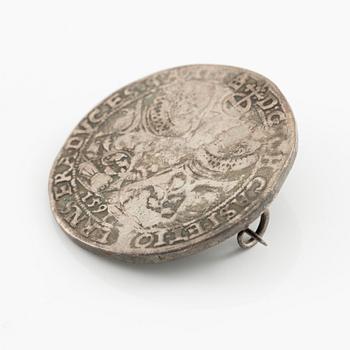 Two bracelets, a brooch, and a pendant with coins.