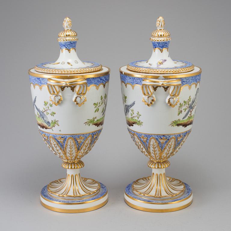 A pair of French 19th century porcelaine 
lidded vases with Sèvres style mark.