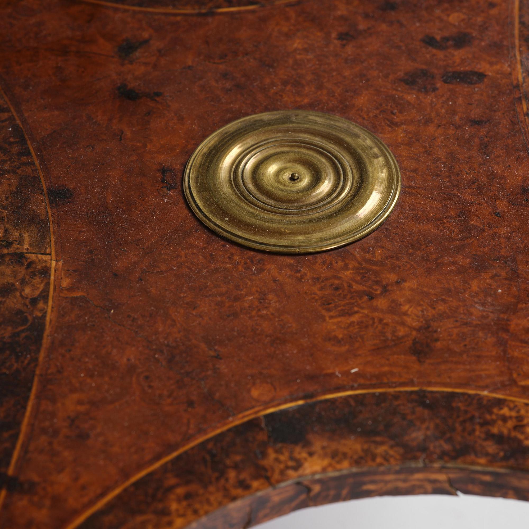 A Gustavian burr-parquetry and bilt brass-mounted table by A. Lundelius (master in Stockholm 1778-1823).