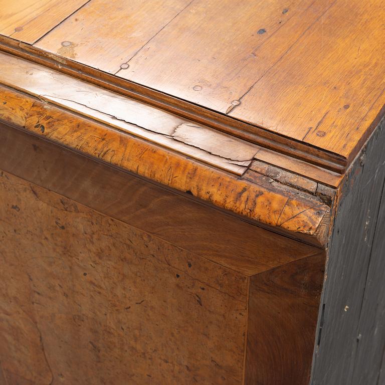 A Swedish root veneered late baroque chest of drawers, first half of the 18th century.