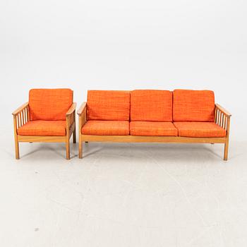 An oak easy chair ans sofa "Tiveden" by Gunnar Myrstrand & Sven Engström from the middle of the 20th century.