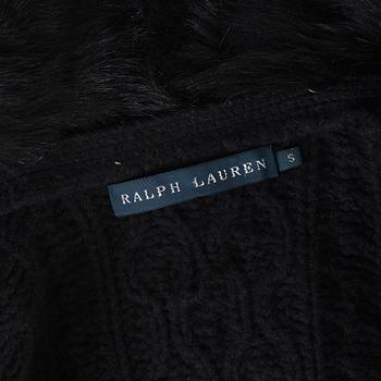 A black knitted cashmere cardiganwith fur collar by Ralph Lauren.