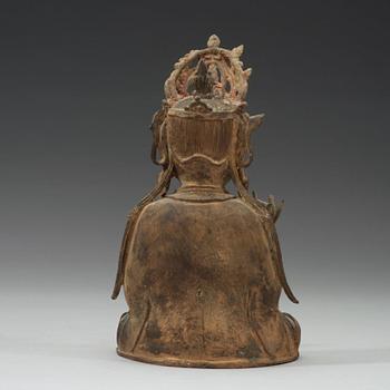 A seated bronze sculpture of Guanyin, late Ming dynasty.