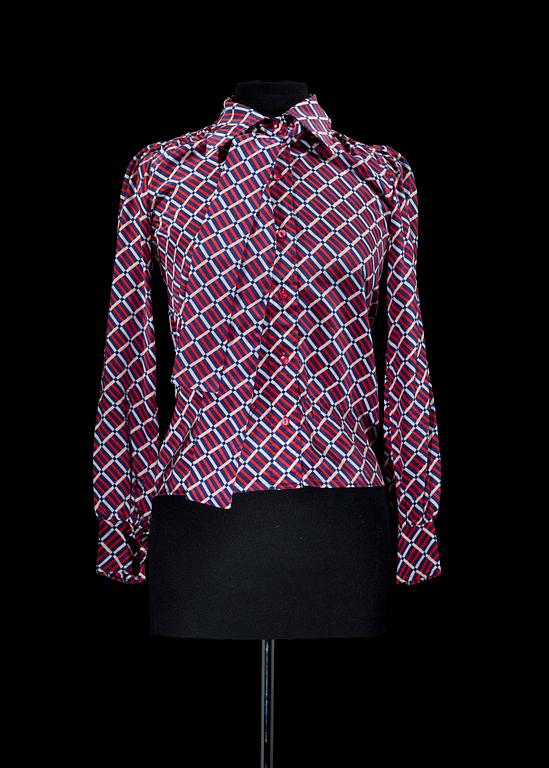 A silk blouse by Yves Saint Laurent.