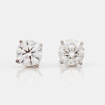 1288. A pair of brilliant-cut diamond earrings, total carat weight 4.10cts. Quality H/VS1. IGI certificates.