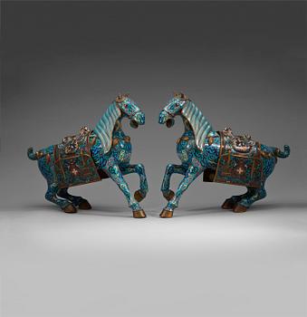 119. A pair of Chinese cloisonné figures of horses, presumably early 20th Century.