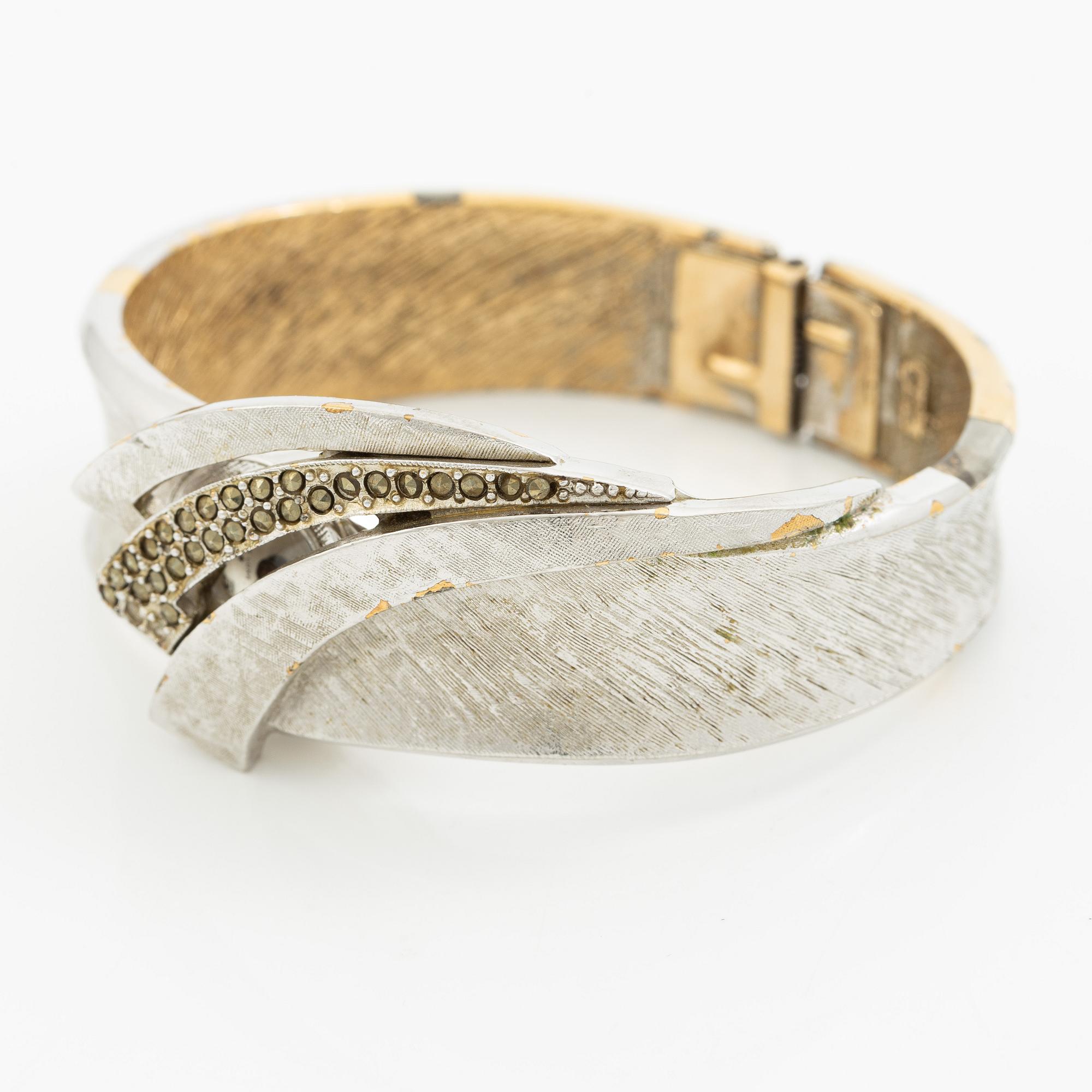 Aftonklocka/armring, Bo Dolk, 18K vitguld med briljantslipade diamanter, 1970-tal.
