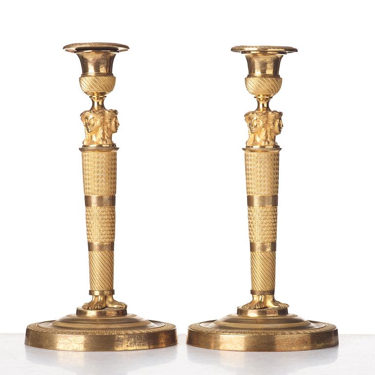 A pair of French Empire candlesticks, early 19th century.