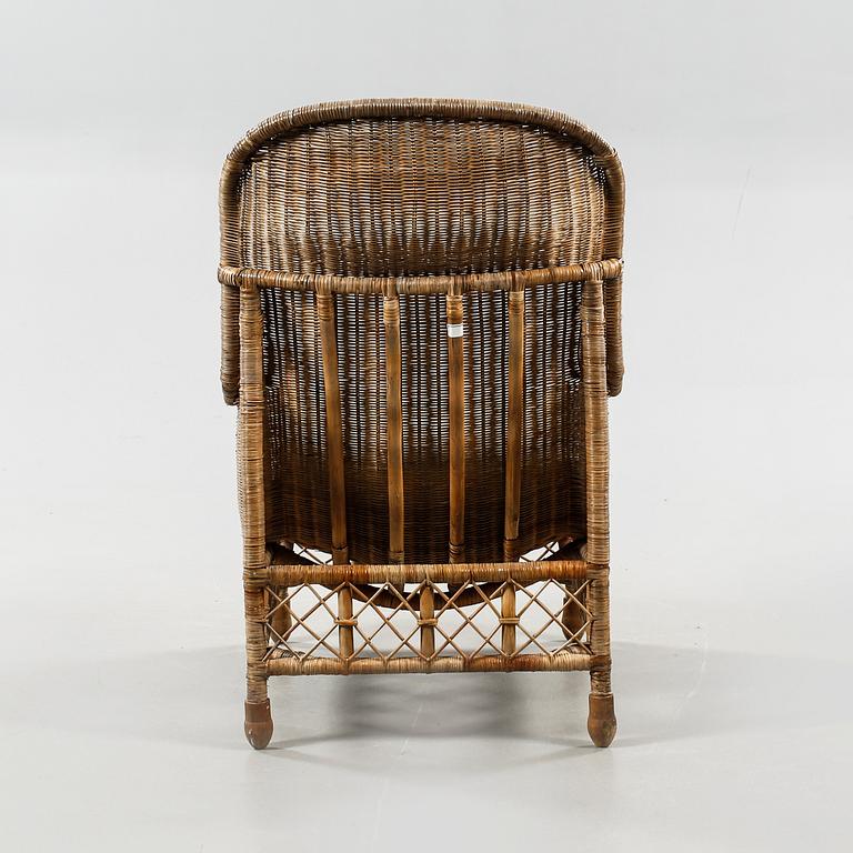 A rattan arm chair from the second half of the 20th century.