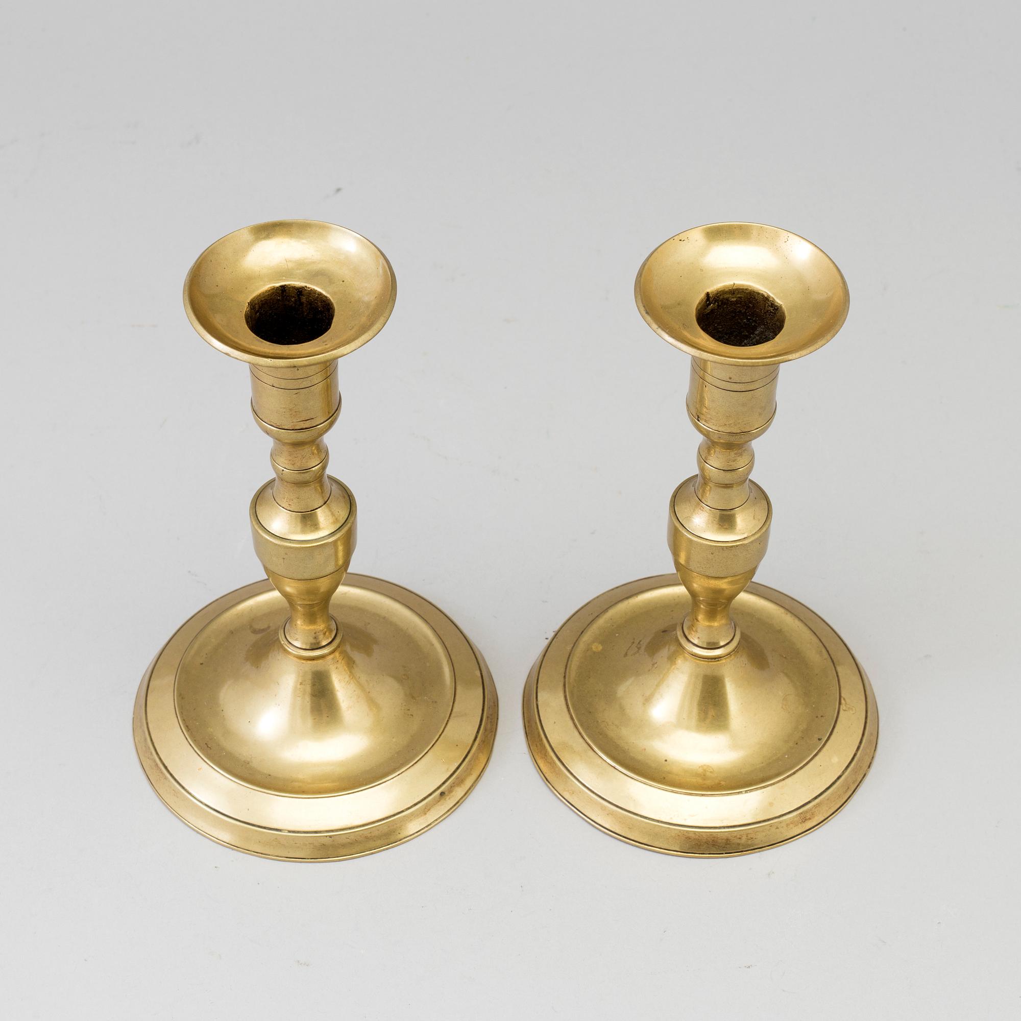 A pair of 19th century bronze candlesticks.