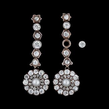 930. A pair of cultured pearl and diamond earrings. Total carat weight circa 2.50 cts. Circa 1900.