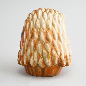 A stoneware figurine, designed by Gunnar Nylund for Rörstrand in the mid 20th century.