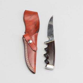 A USA Gerber hunting knife.