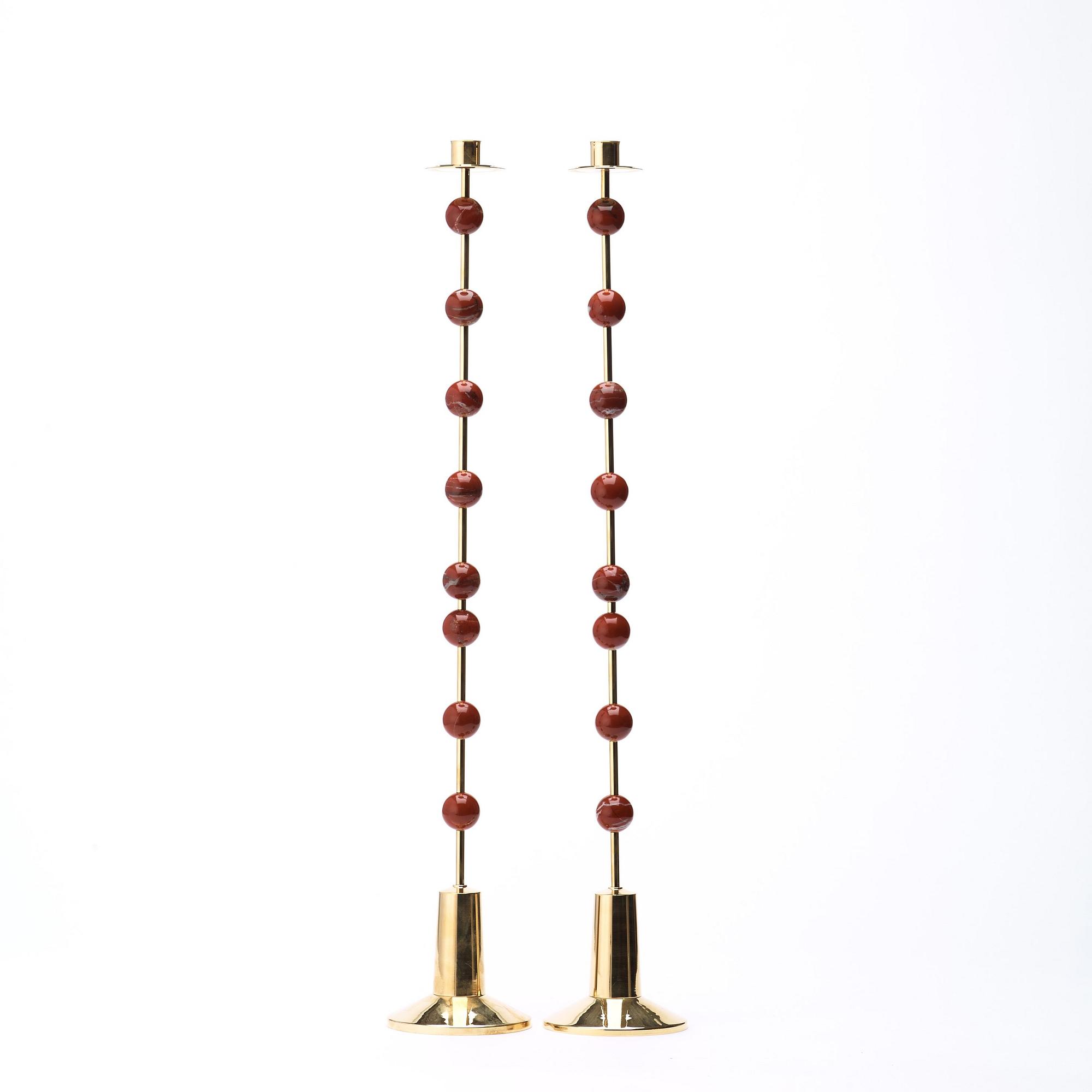 Sigurd Persson, A pair of brass and red jasper candlesticks, Uno Berg AB, Sweden.
