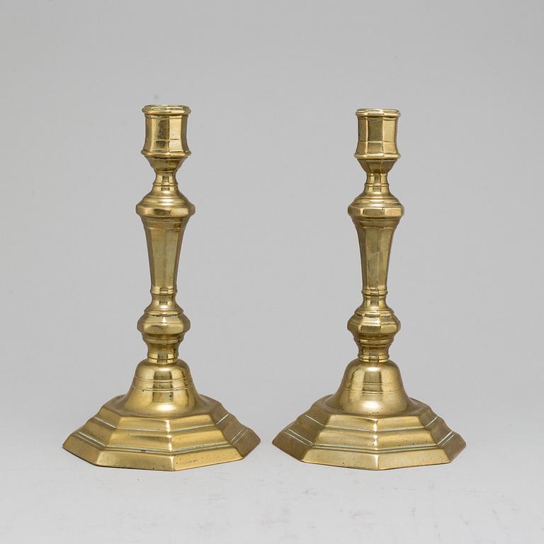 A pair of 18th-Century brass candlesticks, probably from France.