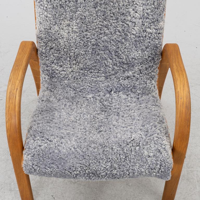 Jan Ekström, armchair with footstool "Gazelle", Conform, 21st century.