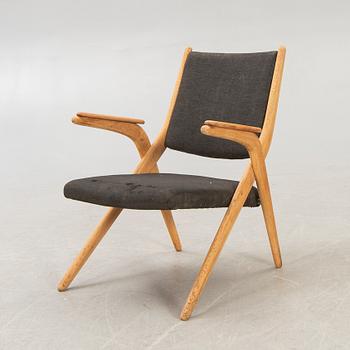 A Swedish oak and teak mid 1900s easy chair.