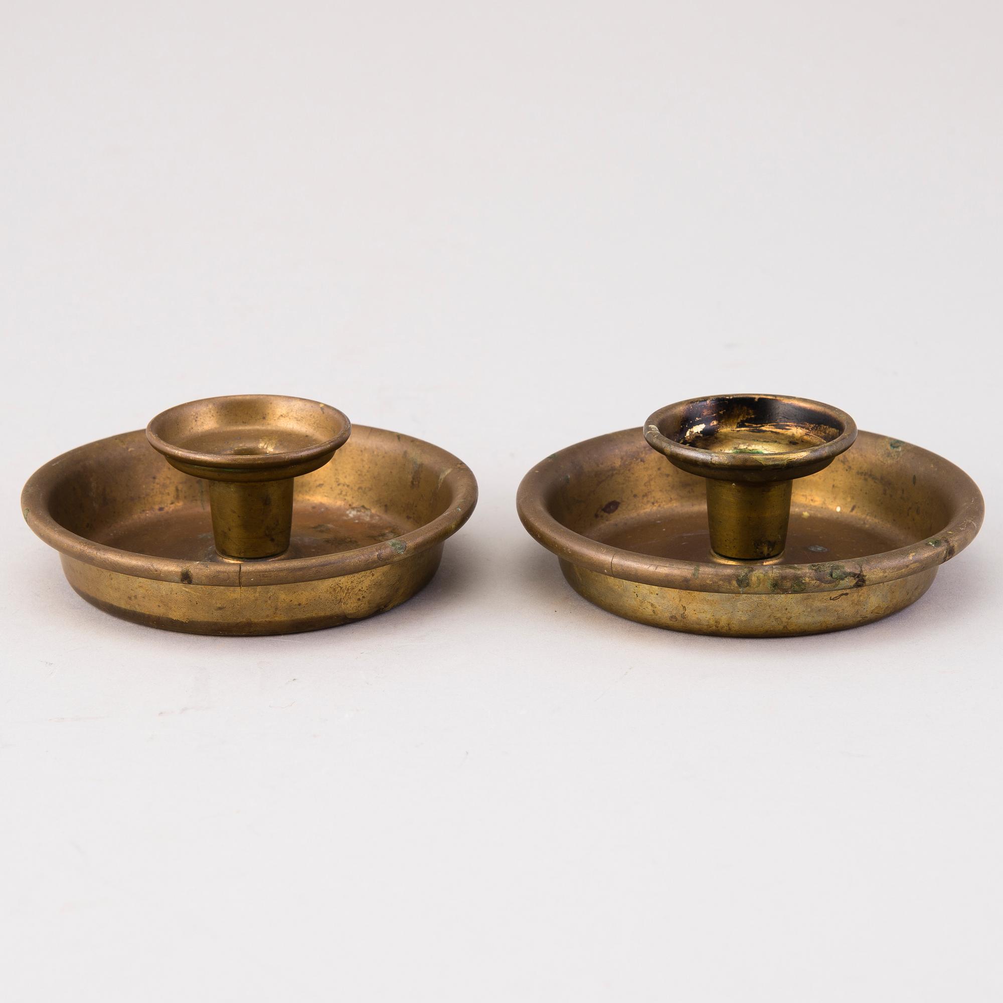 BERTEL GARDBERG, A pair of candleholders in brass, marked Gardberg.