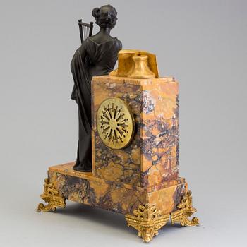 A turn of the century 1900 gilt brass and marble century mantle clock.