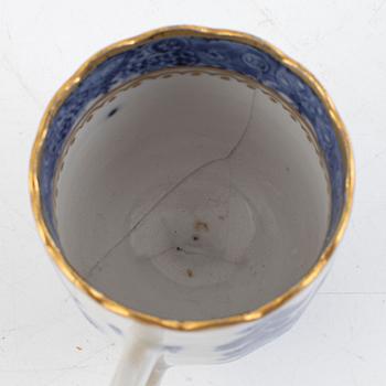 A small Chinese export tureen with cover, two cups, a saucer and a jug with cover, Qing dynasty, 18th century.