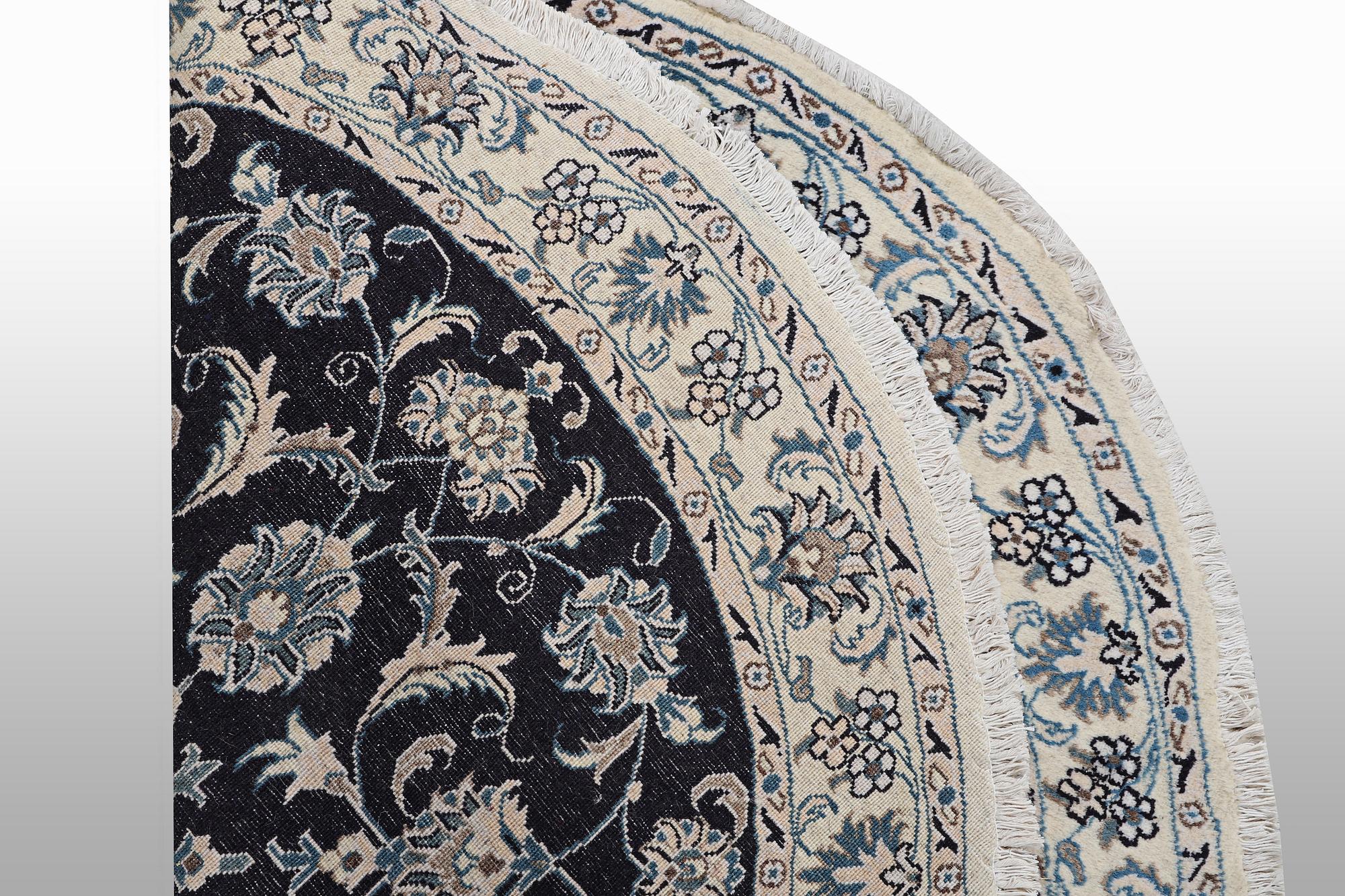A rug, Nain, part silk, ca 140 x 140 cm.