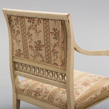 A pair of first half of the 19th century Empire arm chairs.