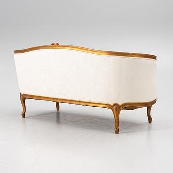 A Louis XV-style sofa, early 20th century.