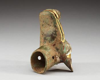 An archaistic bronze handle for a cane in the shape of a mythological animal.