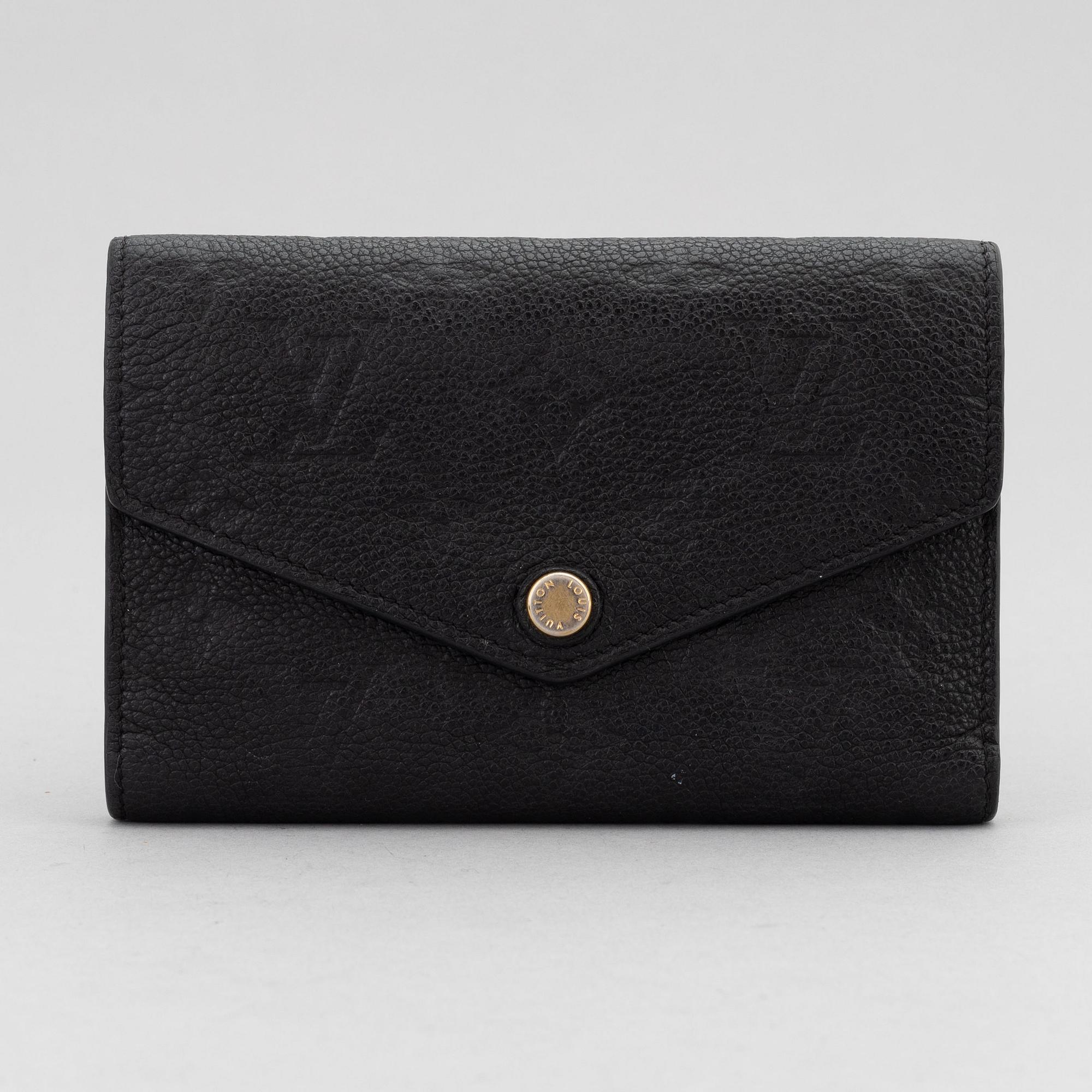 Louis Vuitton, a black Monogram Empreinte leather 'Curieuse' wallet, 2015.