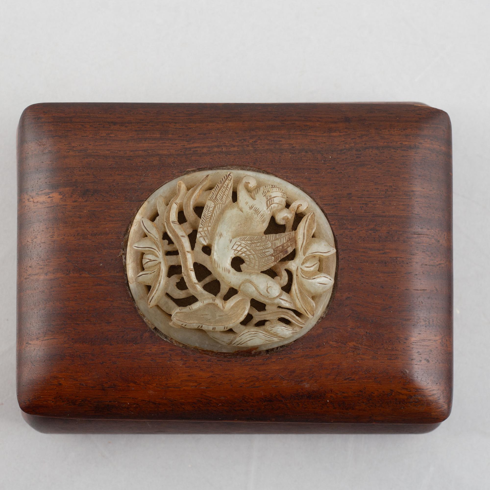 Two Chinese hardwood boxes with nephrite plaques, 20th century.
