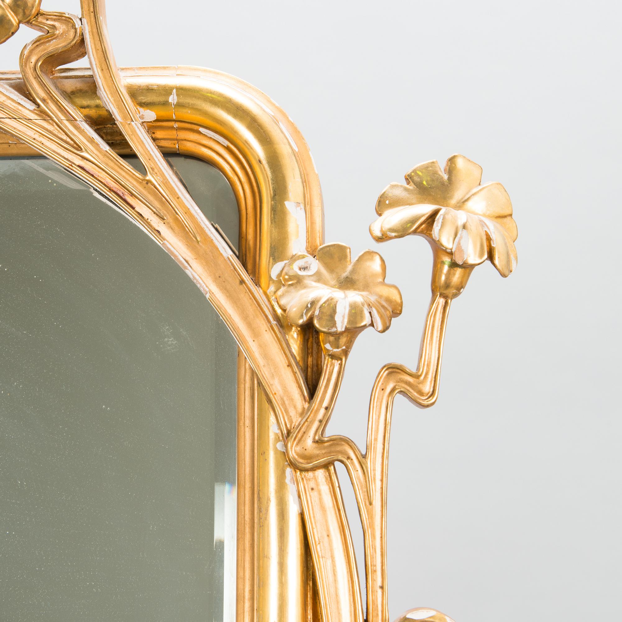 An Art Nouveau mirror with console table from early 20th century.
