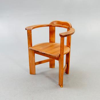 A 1960/70s pine armchair.