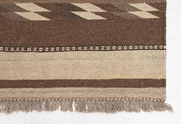 A Persian kilim runner, c. 248 x 62 cm.