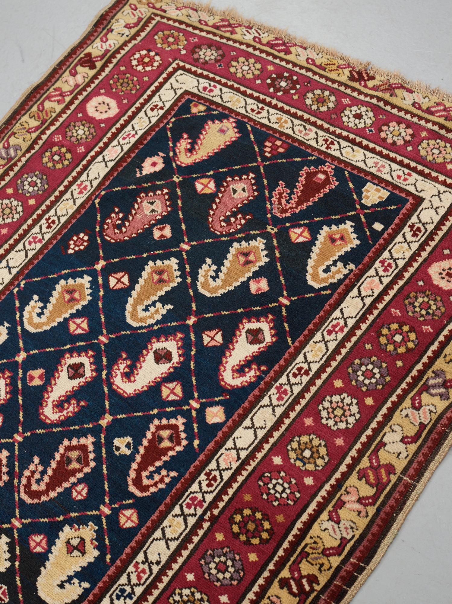 Matto, a runner, an antique Karabagh, ca 268,5-278 x 98,5-103,5 cm.