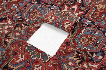 An Antique Heriz carpet, North west persia, c. 380 x 310 cm.