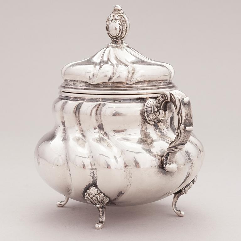 A lidded silver sugar bowl and a set of six silver bowls, Germany.