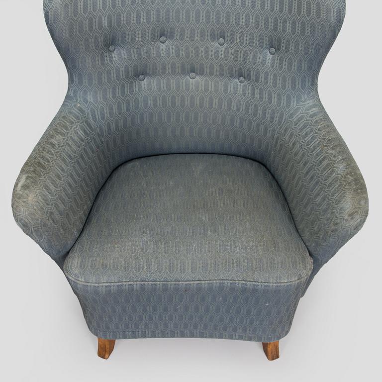 A pair of mid-20th century armchairs.