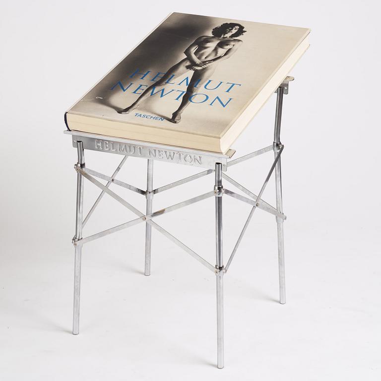 Helmut Newton, Signed book published by Taschen, Monte Carlo, 1999, ed 10000, with a metal table.