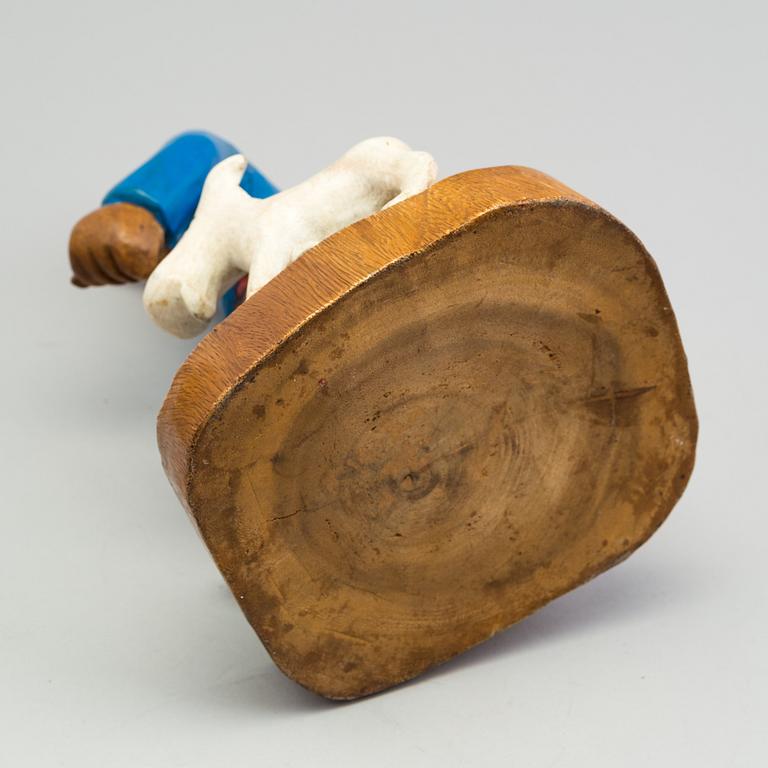 a Tintin and snowy wood scuplture from the second half of the 20th century.