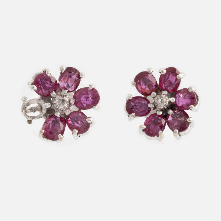 Earrings, one pair, white gold with rubies and small diamonds.