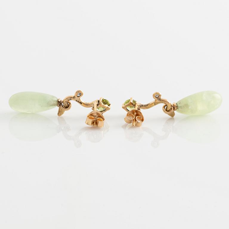 Earrings with pear-shaped prehnite, peridot, and brilliant-cut diamonds.