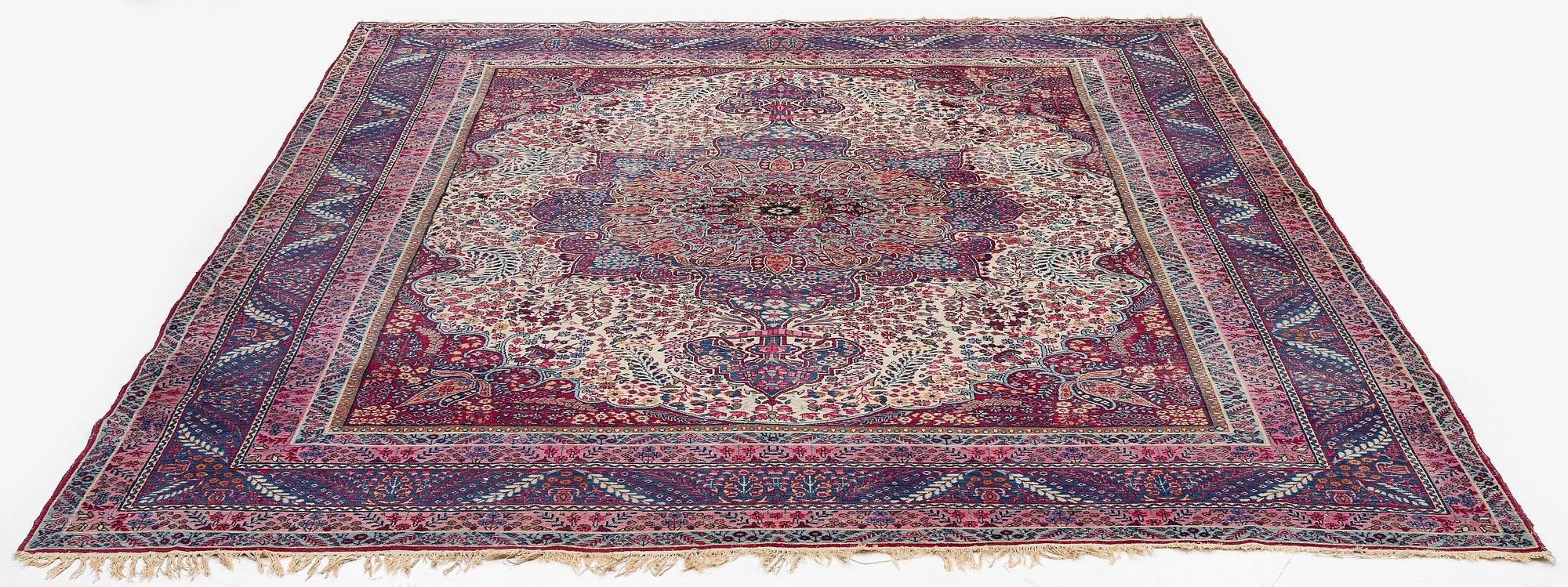 A semi-antique Kirman carpet, South Persia, c. 380 x 289 cm.