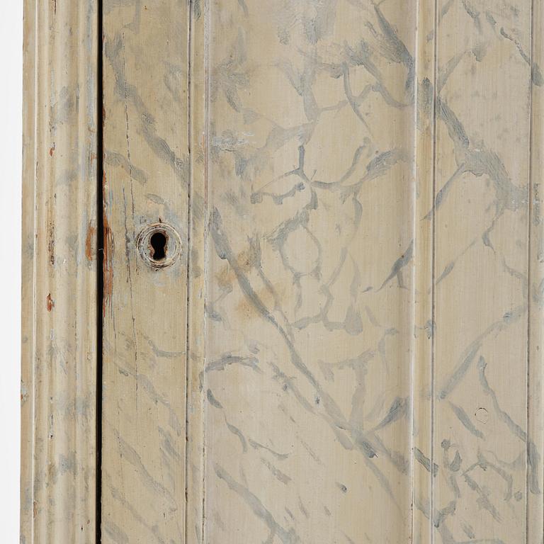 A Swedish column-shaped cabinet 19 th century.