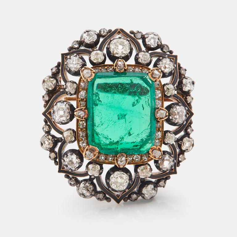 An emerald, black enamel and old cut diamond brooch. 19th century.