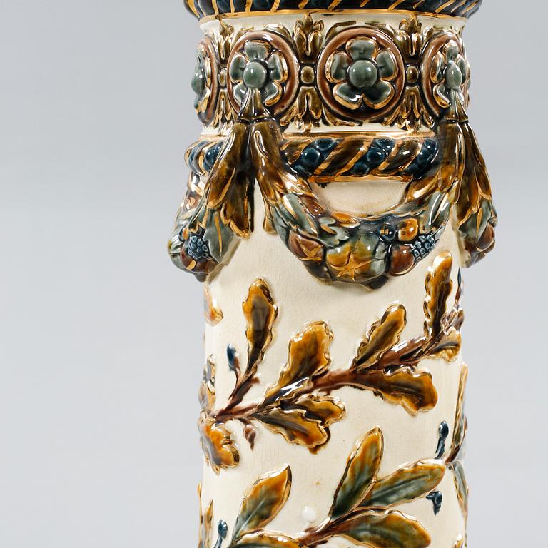 A majolica urn with pedestal from Rörstrand, around the year 1900.