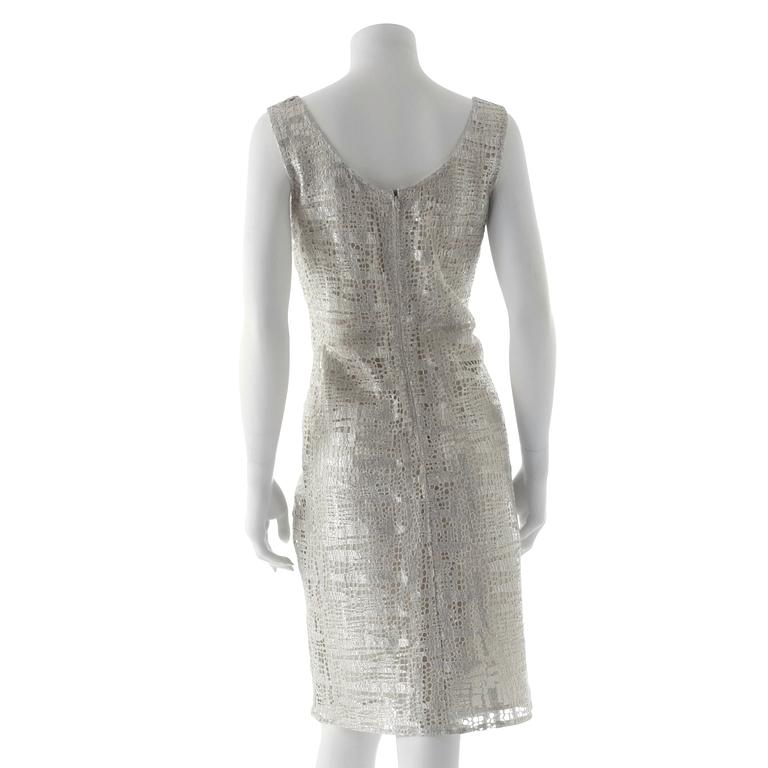 ESCADA, a silver colored sleeveless dress.