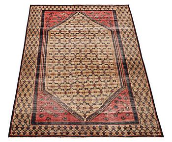 An oriental rug, vintage design, ca. 205 x 124 cm.